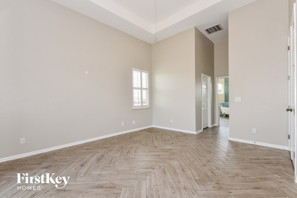 the living room and dining room with hardwood flooring