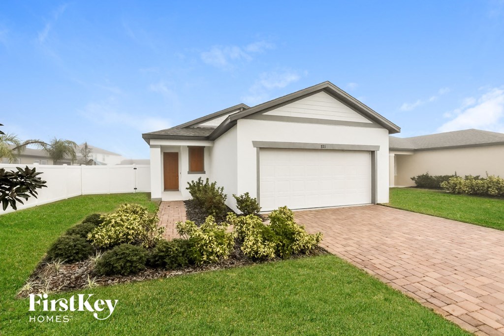 a home with a driveway and a garage door