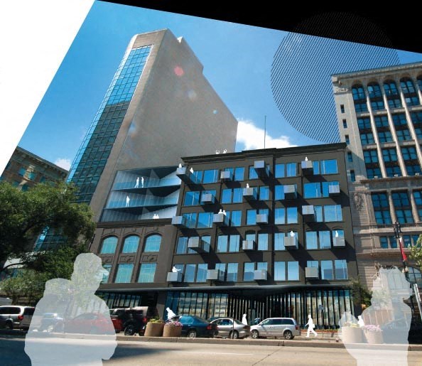 a reflection of a tall building in a window