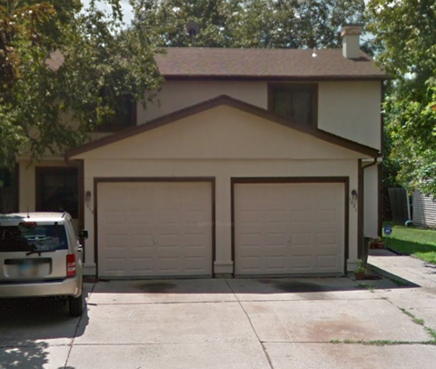 a house with a car parked in a driveway