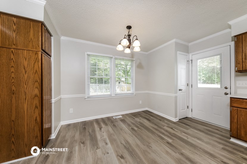 the kitchen and dining room of a rental house