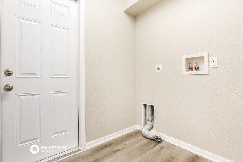 a snake in a room next to a white door