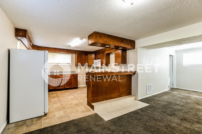 view of the living room and kitchen of a renovated house