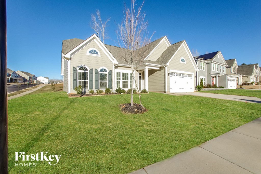 a house with a tree in the front yard