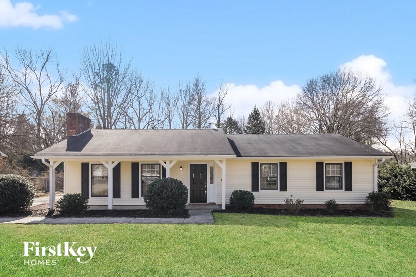 A white house with a black door and windows is shown with the words "FirstKey Homes" on the bottom left.