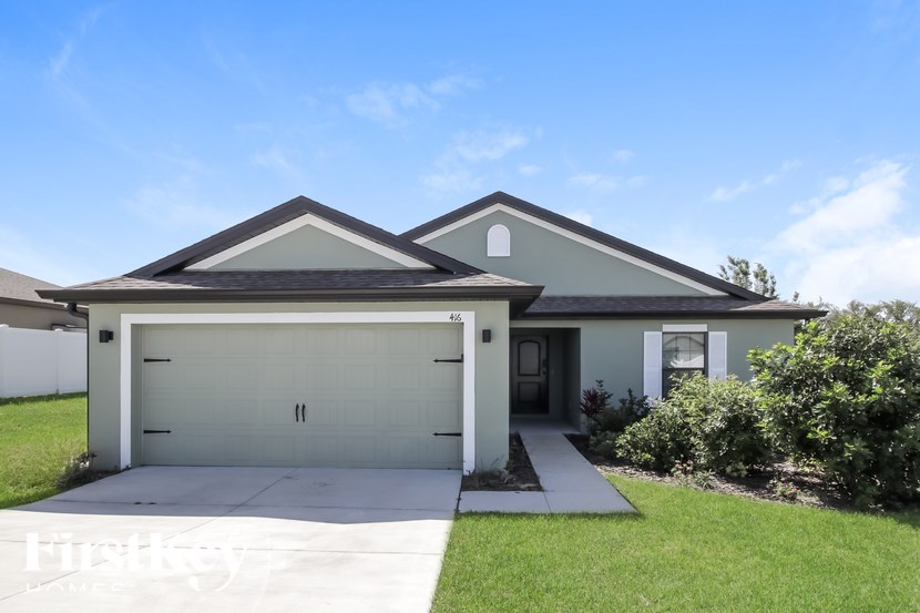 A two-car garage is attached to a house.