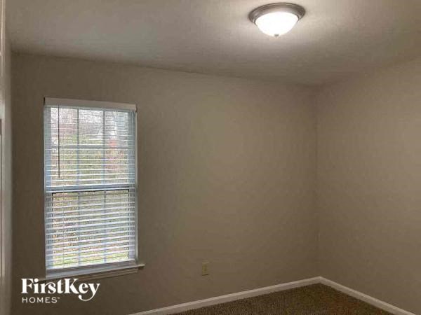 A room with a window and a FirstKey Homes logo.
