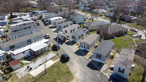 an aerial view of a neighborhood with houses and cars