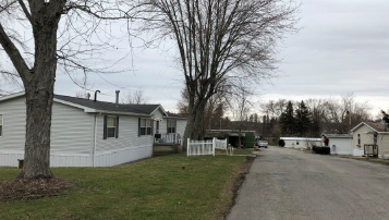 a white house on the side of a road