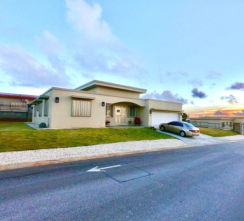 a house with a car parked in front of it