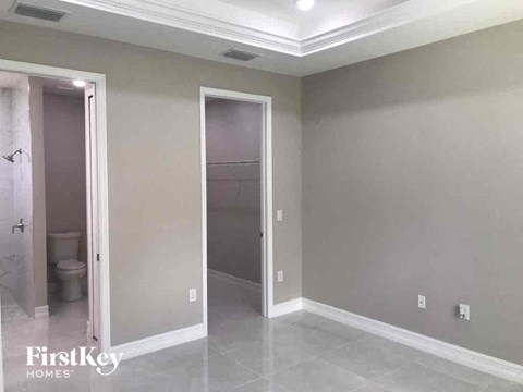 A bathroom with a toilet and a walk-in shower.