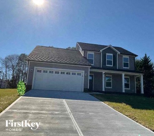 a house with a driveway and a garage door