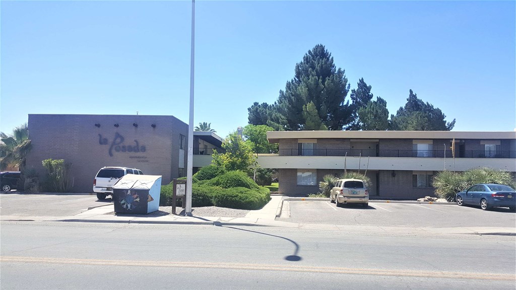 an empty parking lot in front of an office building