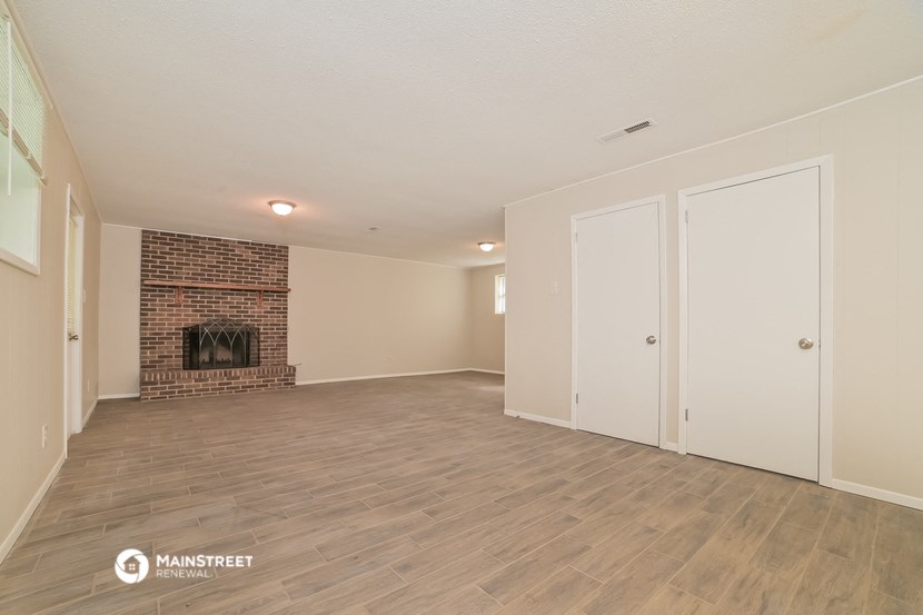 the living room of our studio apartment atrium with a fireplace