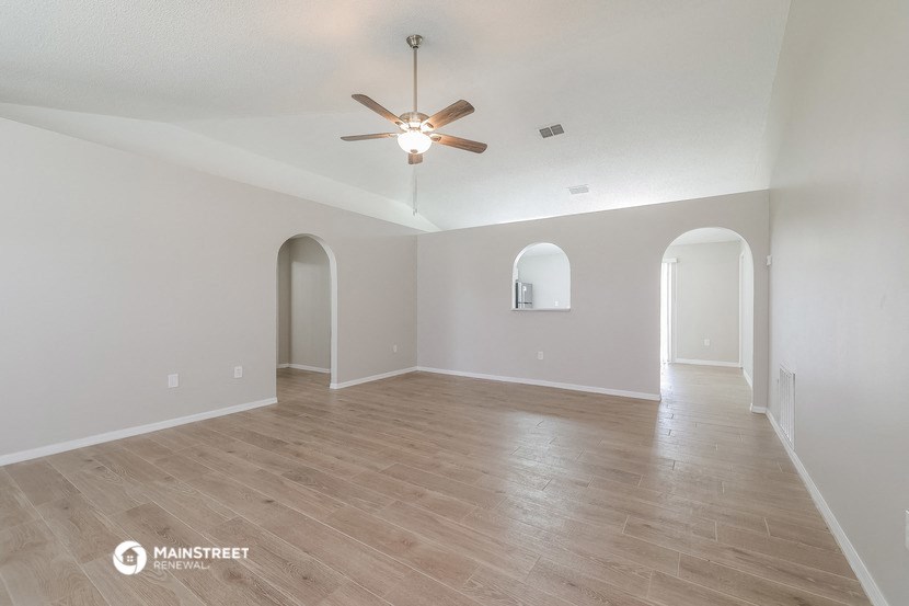 the living room and dining room are spacious and empty