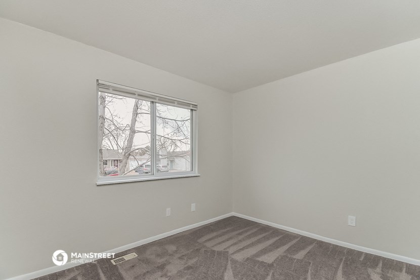 the living room of a manufactured home with a window