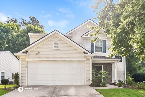 a white house with a white garage door