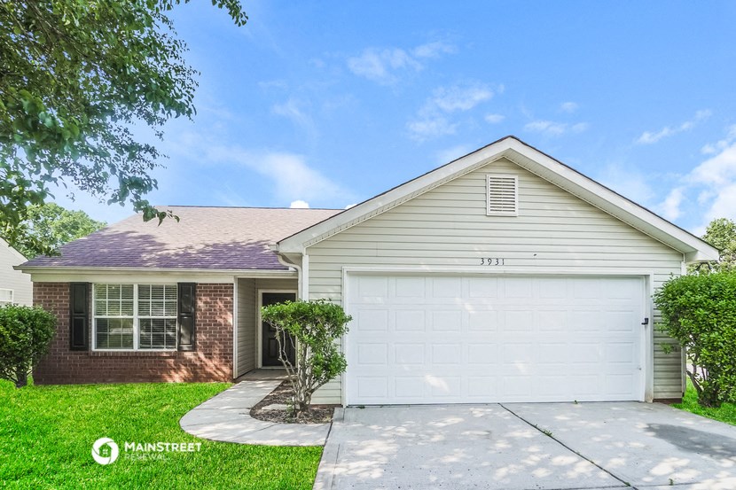 a white garage door in front of a house