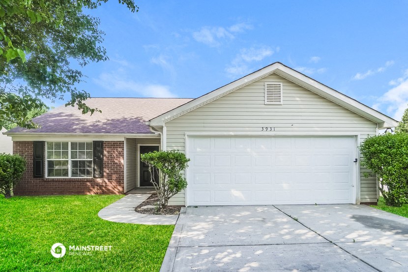 a white house with a white garage door