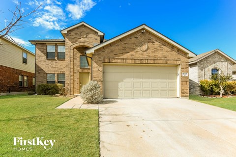 a large brick house with a white garage door