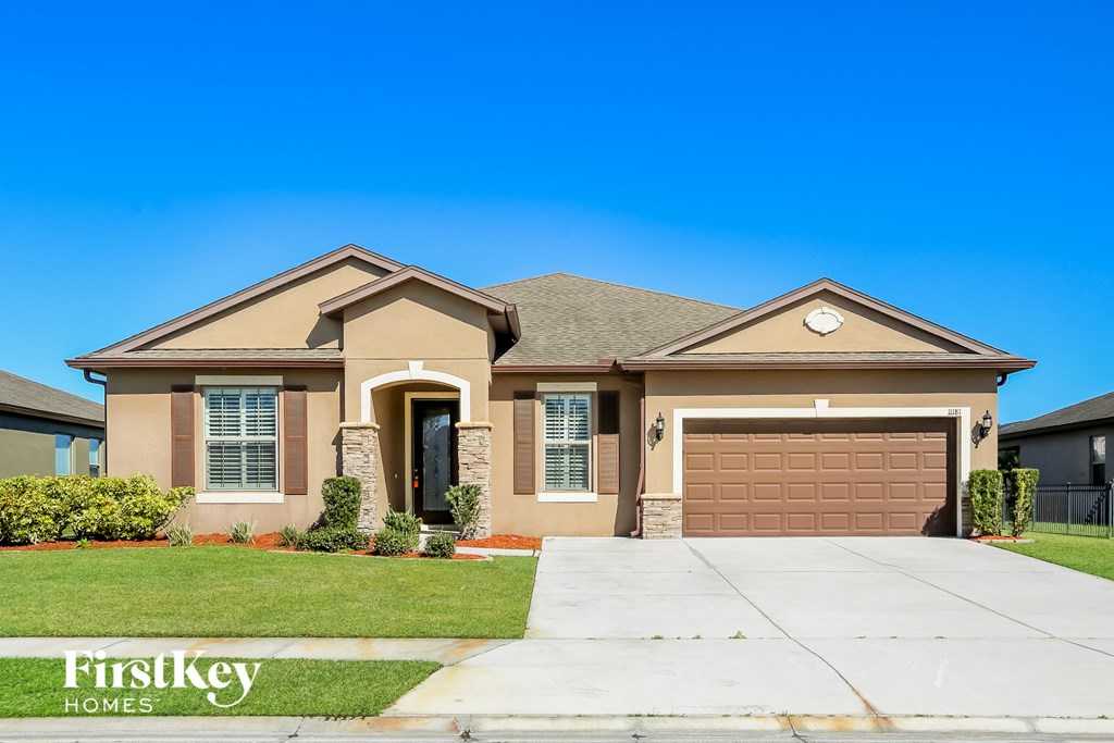 a house with a driveway and a garage door