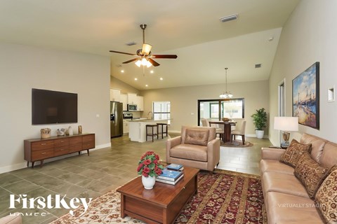 A living room with a brown sofa and a wooden coffee table.