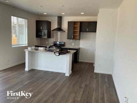 a kitchen with a counter and a stove in it