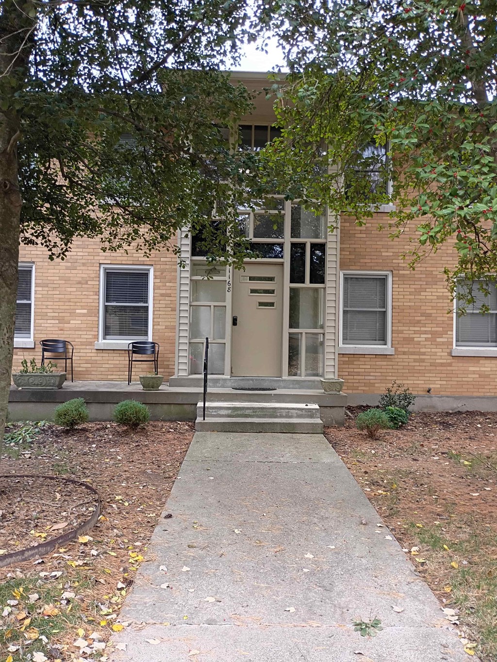A brick building with a door and windows.
