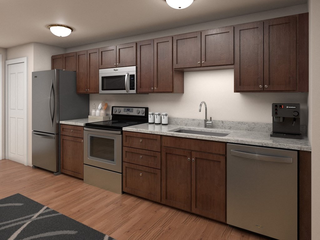 a kitchen with stainless steel appliances and wooden cabinets