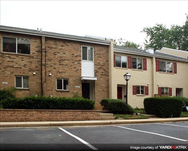 a brick building with a street in front of it
