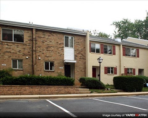 a brick building with a street in front of it