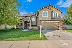 a house with a driveway and a garage door