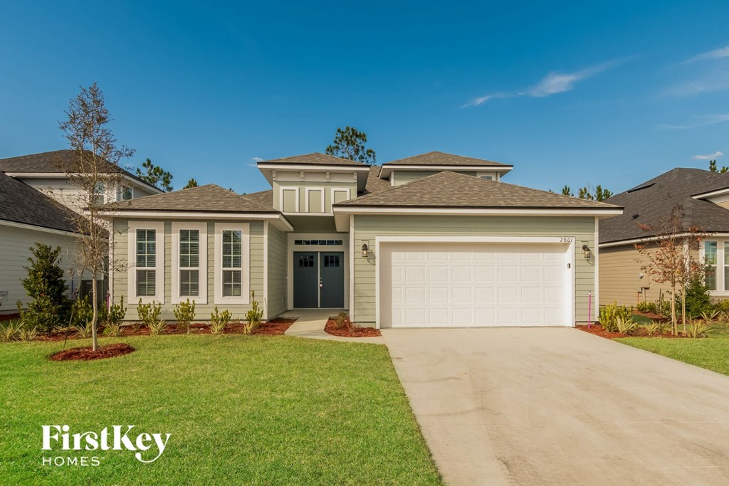A large house with a garage is for sale by FirstKey Homes.