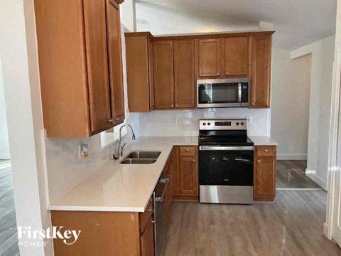a kitchen with a stove and a sink