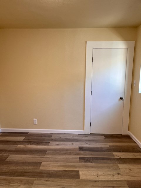 the living room with the door open to the dining room