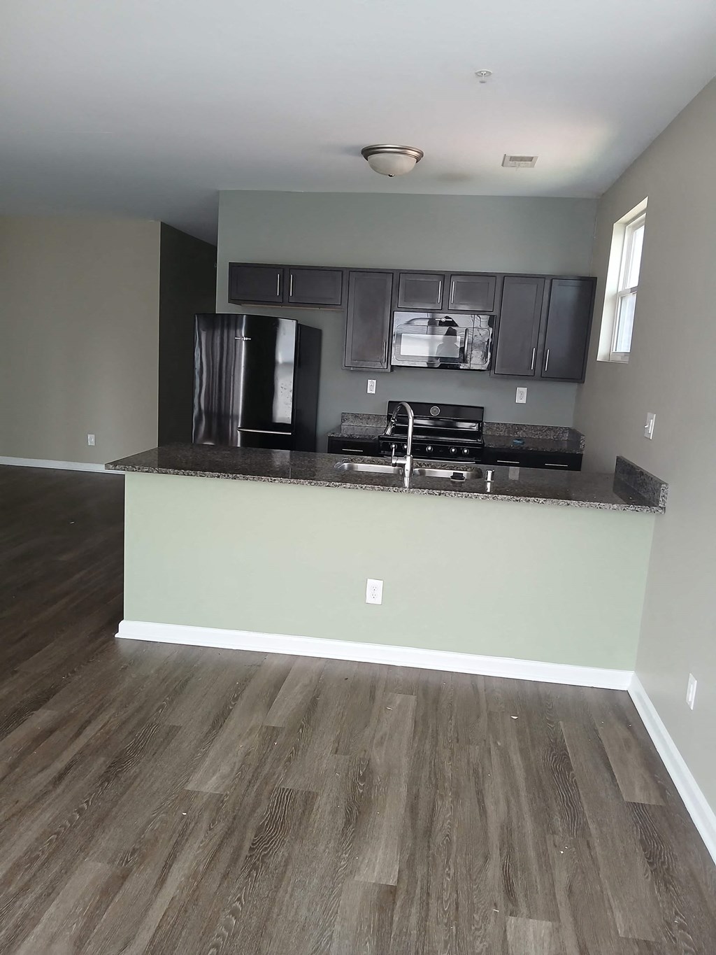 a view of a kitchen with a counter top and