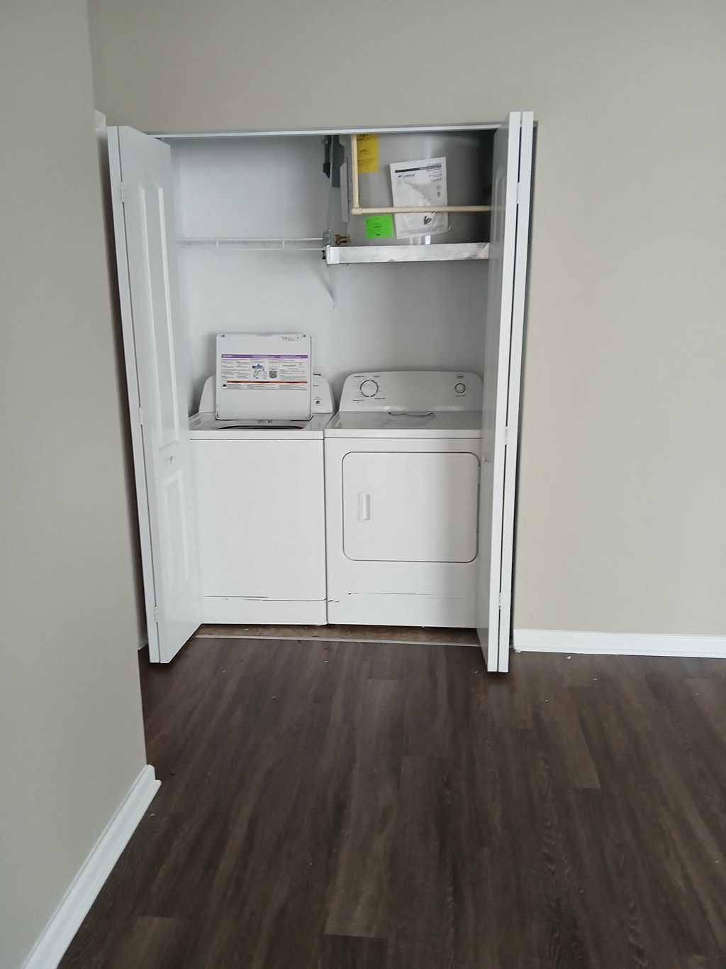 a small laundry room with a washer and dryer in it