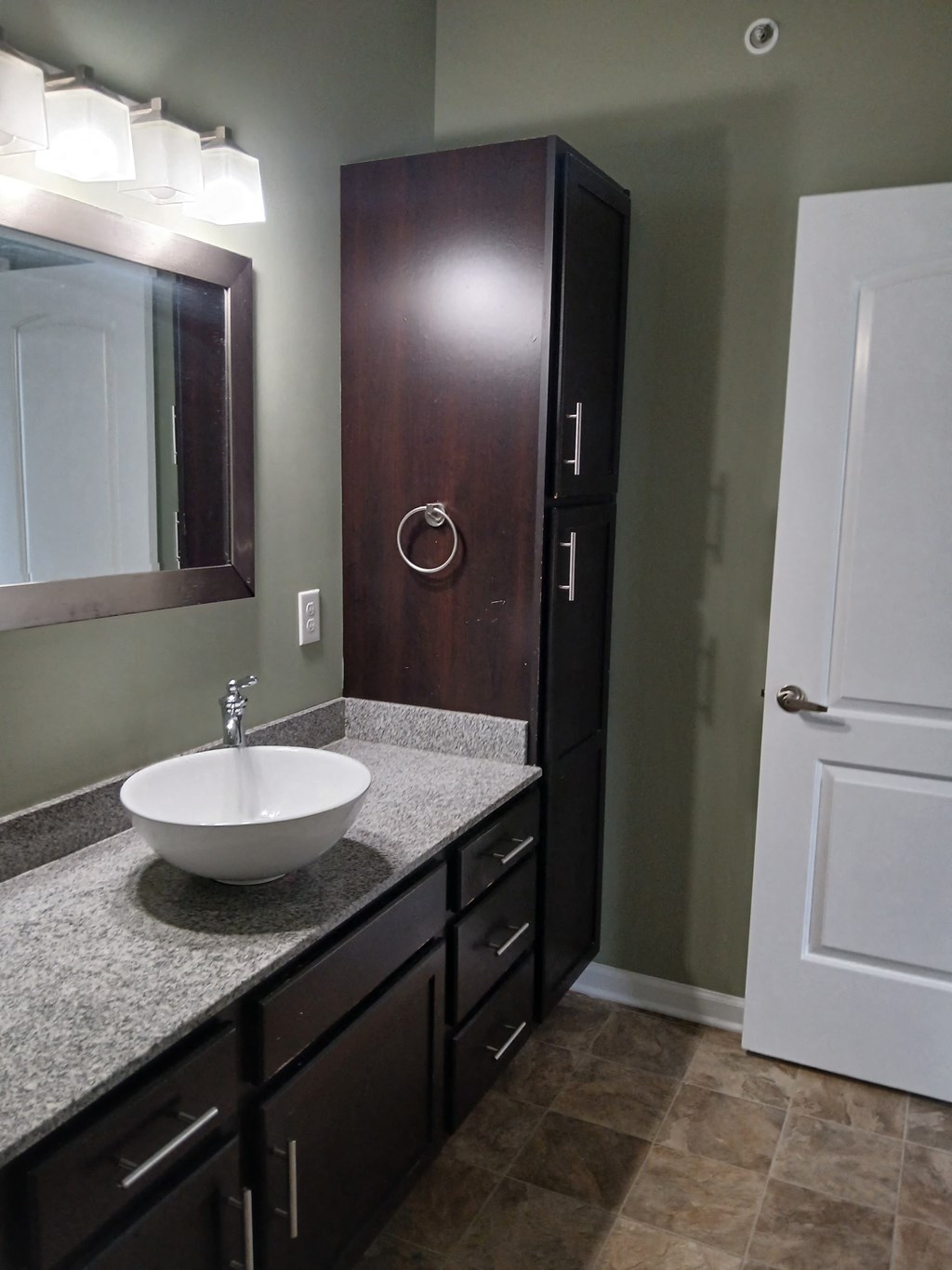a small bathroom with a sink and a mirror