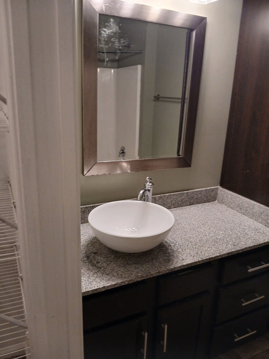 a small bathroom with a sink and a mirror