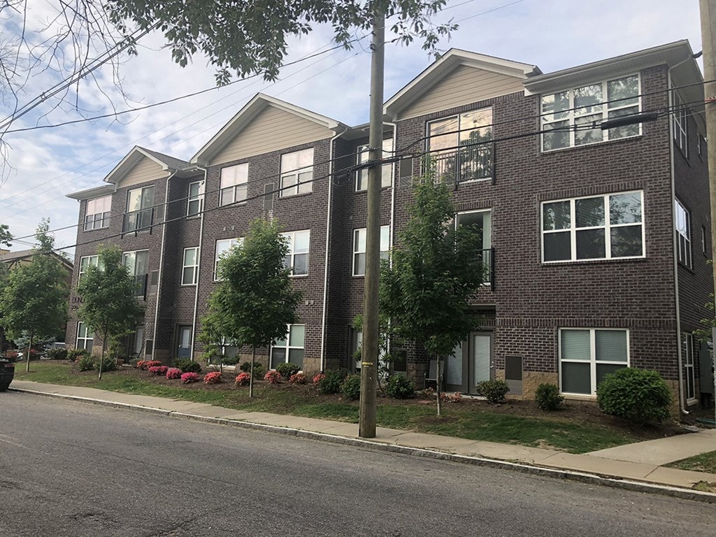 a brick apartment building on a city street
