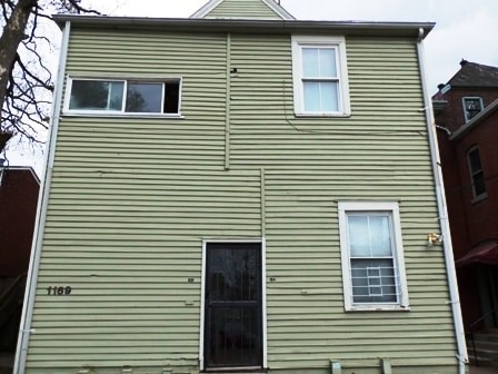 A house with a black door and white windows.