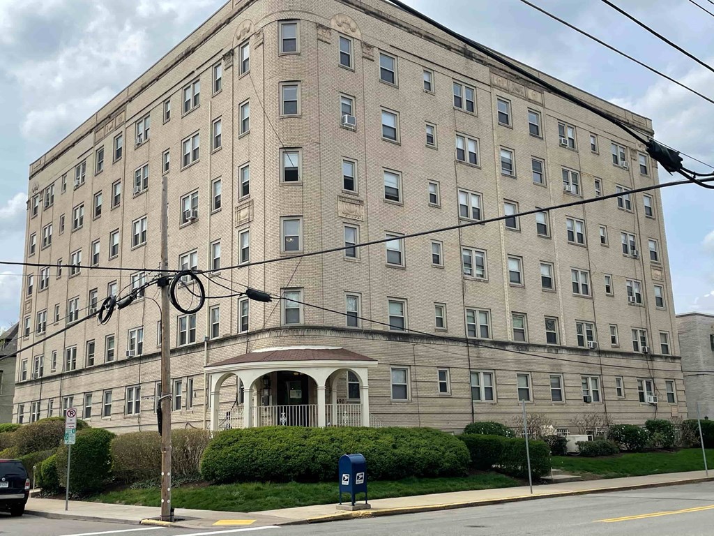 a large building on the corner of a street