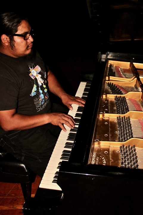 a man sitting at a piano