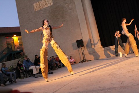 a group of dancers performing on a stage
