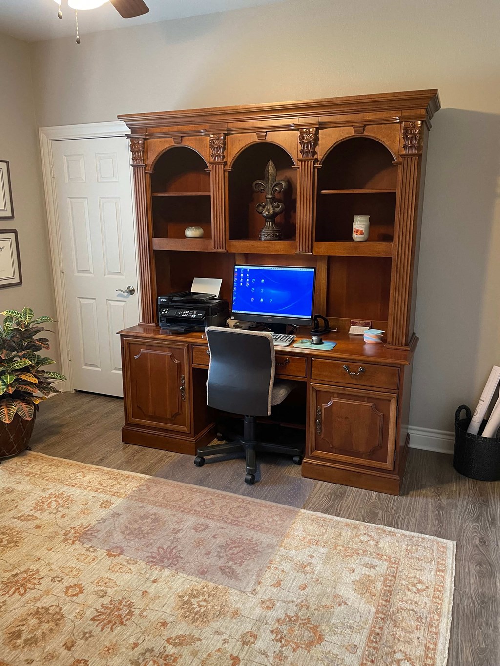 a home office with a desk and a computer