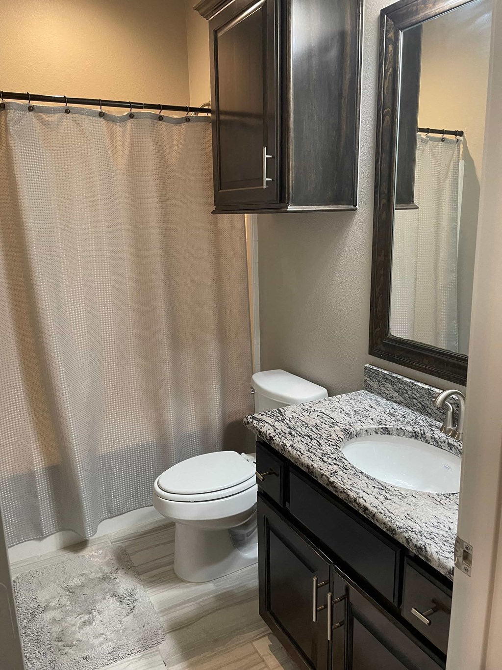 a bathroom with a toilet and a sink