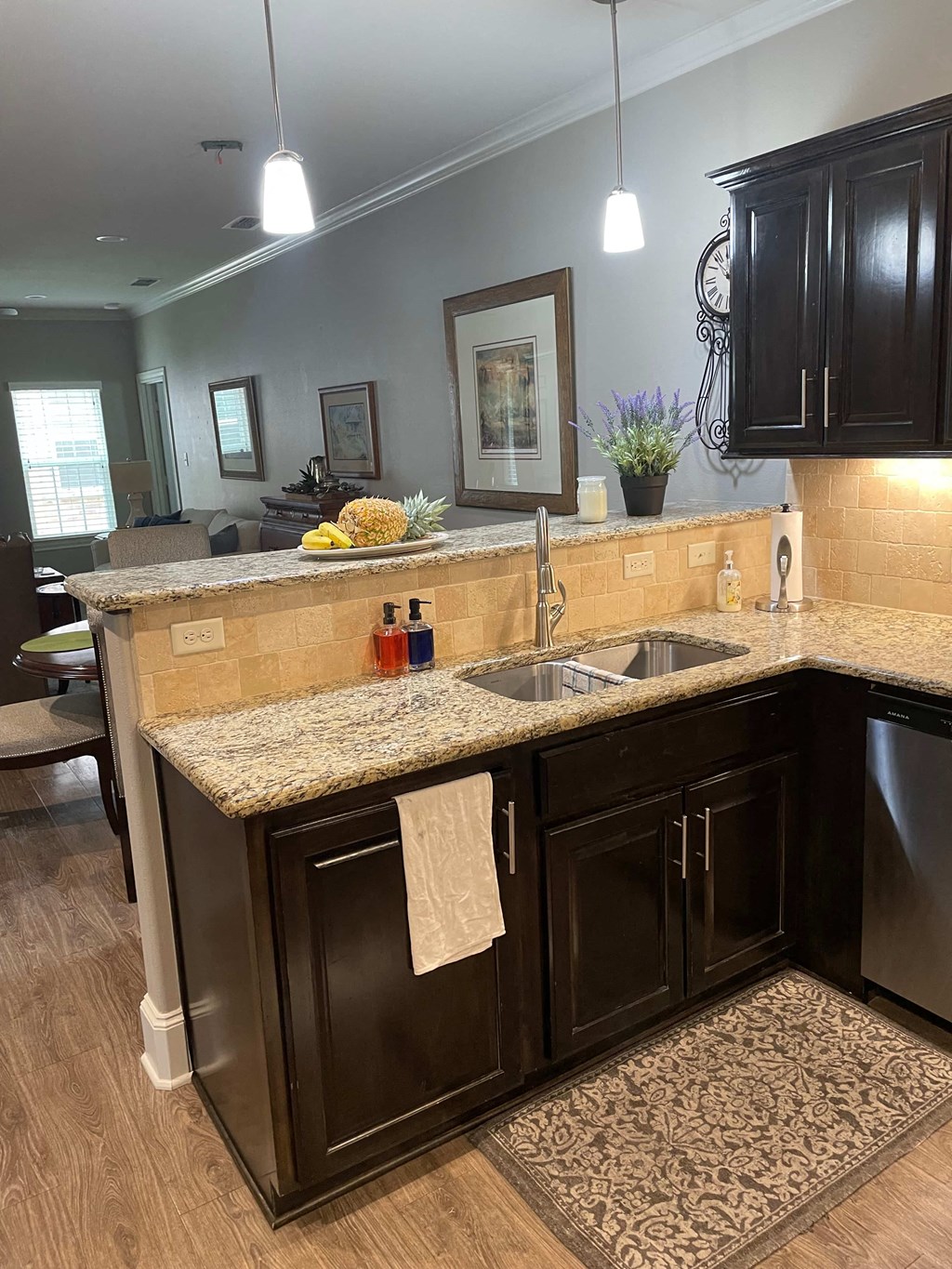 a kitchen with a sink and a counter top