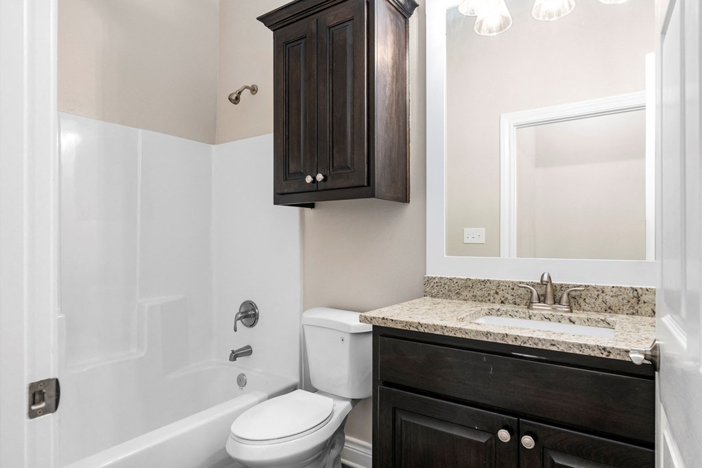 a bathroom with a sink toilet and a shower