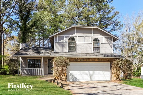 a white house with a white garage door