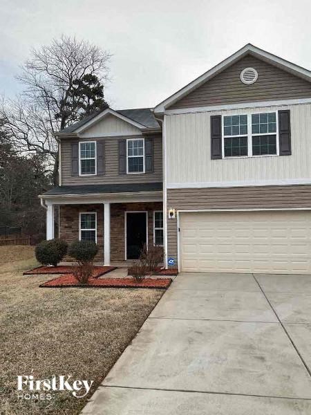a house with a sidewalk in front of it